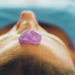 A purple gem on a woman's forehead